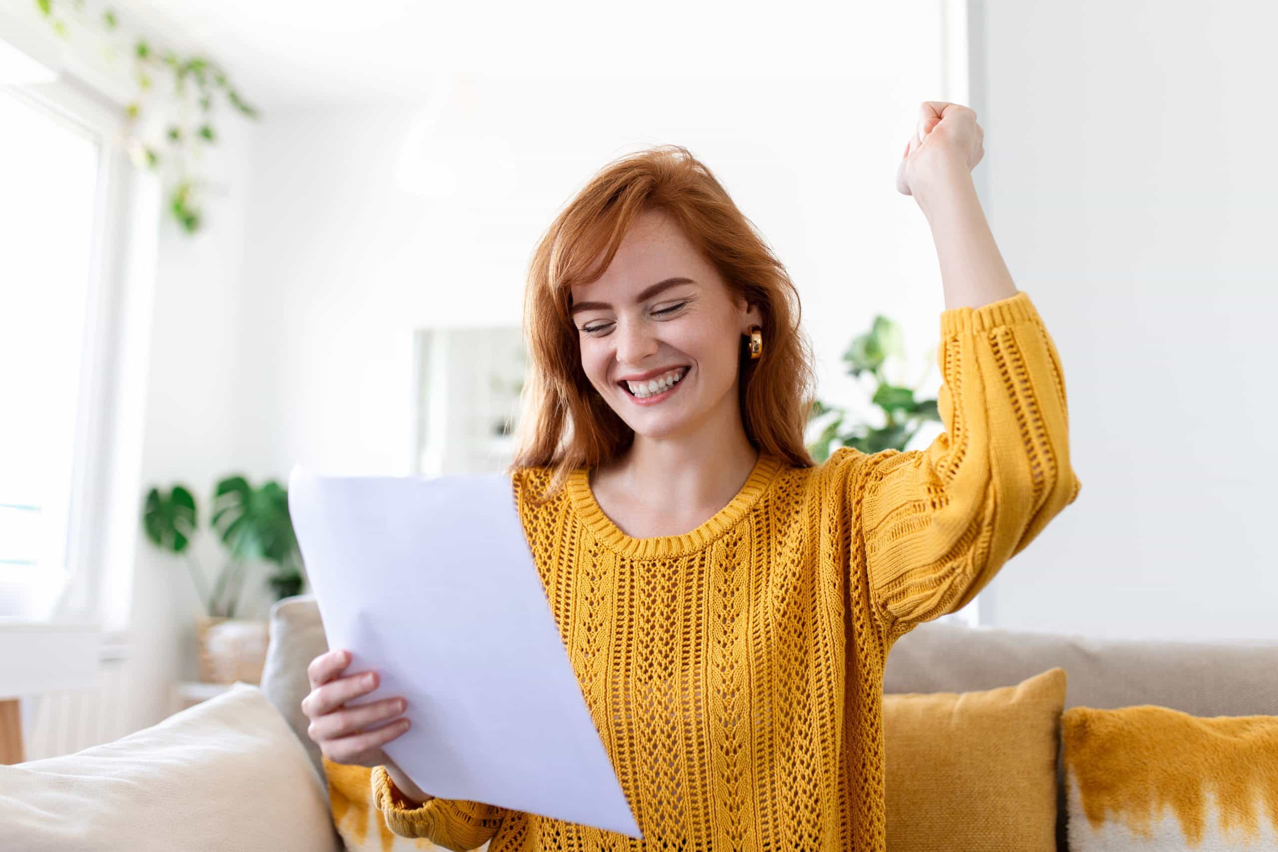 excited-young-woman-hold-paper-letter-feel-euphoric-receiving-job-promotion-tax-refund-from-bank-happy-woman-reading-paperwork-document-smiling-good-pleasant-news-getting-student-scholarship (1)